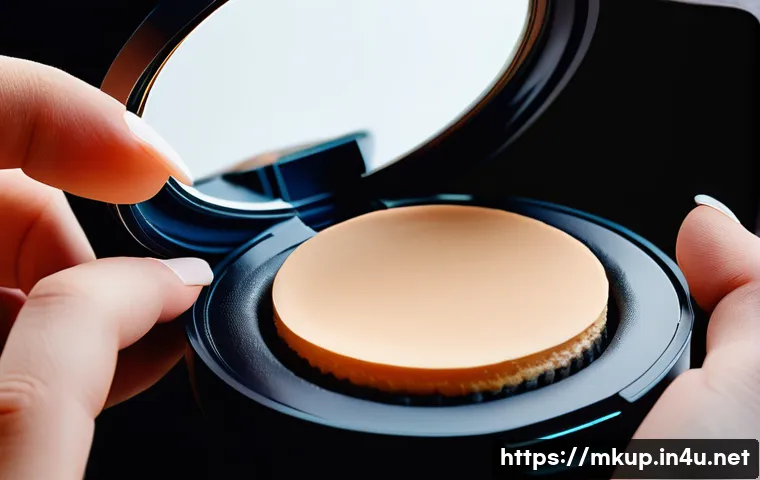 트윈 케익 파운데이션 장단점 - A close-up image of a compact twin cake foundation case with a built-in puff, opened to reveal a smo...